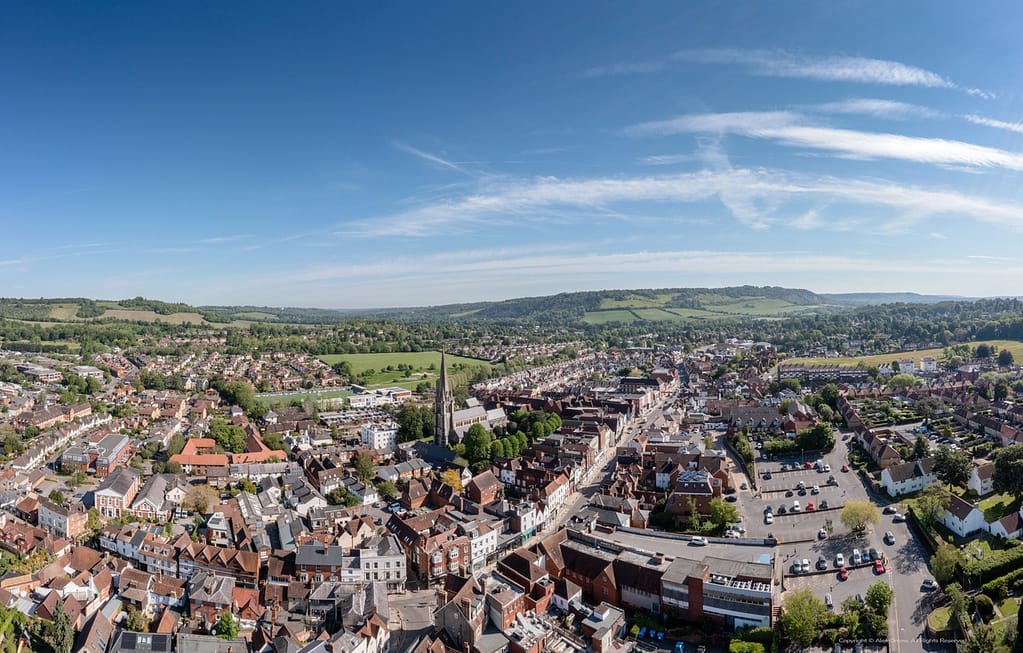 Aerial drone view of Dorking Town Centre with St.Martins Church and Box Hill