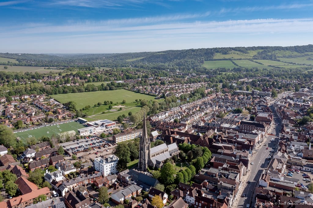 Aerial drone panorama view of Dorking Town Centre with St.Martins Church and Box Hill