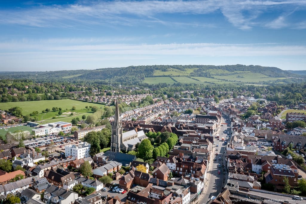 Aerial drone panorama view of Dorking Town Centre with St.Martins Church and Box Hill