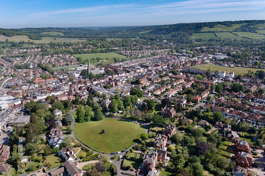 Aerial drone panorama view of Dorking Town Centre with Rose Hill Paddock St.Martins Church and Box Hill